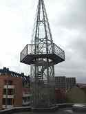 RVS frame constructie met glasbekleding van minaret toren.